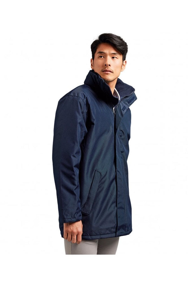 Men’s navy pilot parka jacket worn by model with hood and zip front angled view